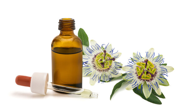 Passionflower Branch with flowers and Herbal Extract Dropper and Bottle Isolated on White Background