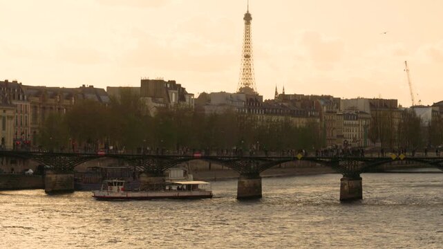 Eiffel Tower and Seine River with Historic Bridge at Sunset in Paris, France