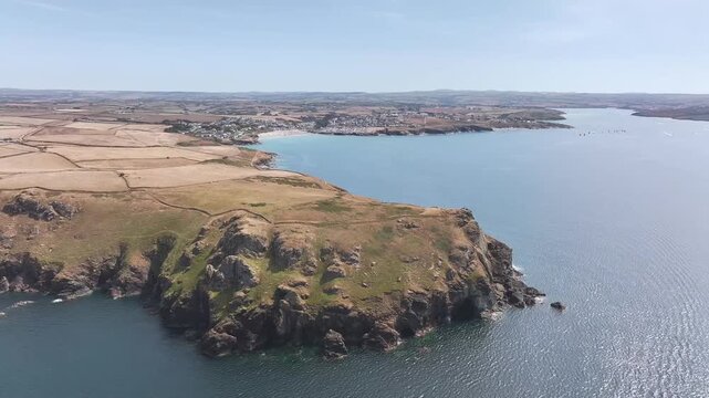 Seven Souls Rock and Pentire Point and Bay over Padstow Bay from a drone, Polzeath, Cornwall, England, Summer 2026