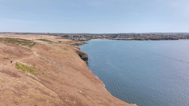 Seven Souls Rock and Pentire Point and Bay over Padstow Bay from a drone, Polzeath, Cornwall, England, Summer 2026