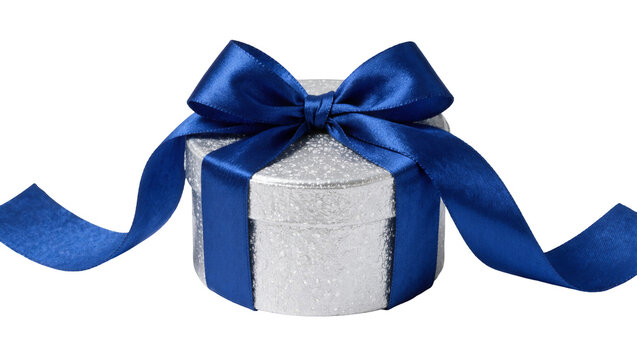 Sparkling silver round gift box with royal blue satin ribbon bow, isolated on transparent background