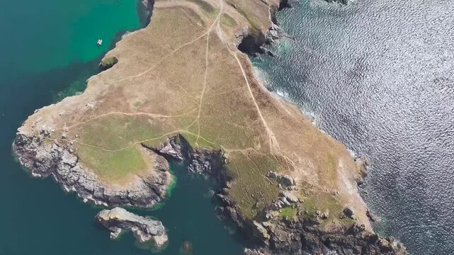 Seven Souls Rock and Pentire Point and Bay over Padstow Bay from a drone, Polzeath, Cornwall, England, Summer 2026