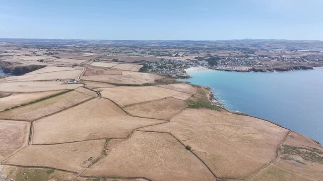 Seven Souls Rock and Pentire Point and Bay over Padstow Bay from a drone, Polzeath, Cornwall, England, Summer 2026