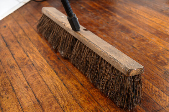 brush broom on wooden floor, construction copy space background image
