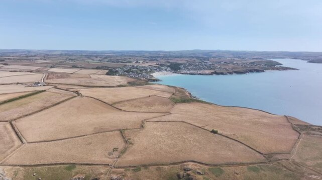 Seven Souls Rock and Pentire Point and Bay over Padstow Bay from a drone, Polzeath, Cornwall, England, Summer 2026