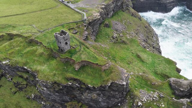 High angle drone view of Moher Tower and Hag's Head cliffs, County Clare, Ireland