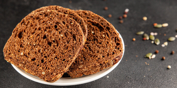Black bread whole-grain rye flour slices of dark bread healthy eating delicious snack fresh, gourmet, rustic food background on the table top view copy space