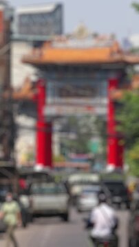 Bokeh view of road traffic in Bangkok, Thailand. Blurred background vertical footage.