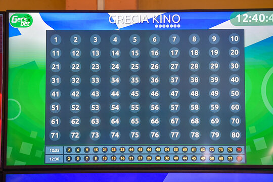 Bucharest, Romania - November 10, 2023: Electronic display monitor inside a betting shop showing live Grecia Kino lottery draw numbers and Get's Bet gambling system results.