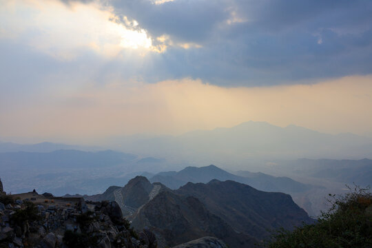 Saudi Arabia Tourism - Dramatic sunbeams breaking through clouds over Al Hada mountain in Al Taif, - Saudi National Day and travel 