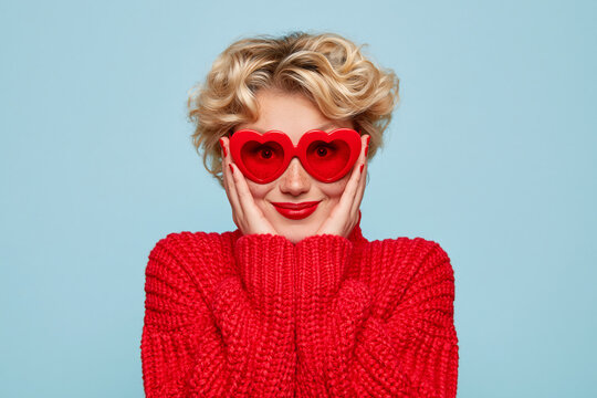Woman Wearing Heart Sunglasses and Red Sweater