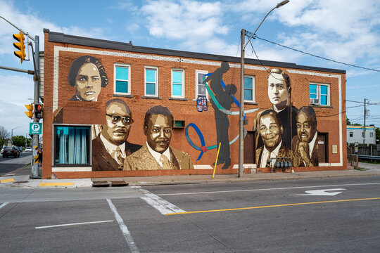 A McDougall Street Corridor mural honouring Windsor's Black pioneers, part of a wave of heritage installations including the new Emancipation Monument, Windsor, Ontario, Canada, July  2026.