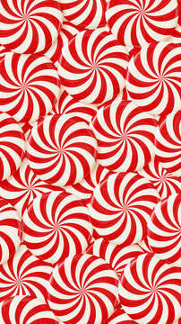 Vibrant red and white striped peppermint hard candies arranged in a festive repeating winter holiday illustration, seamless candy swirl pattern background, with copy space