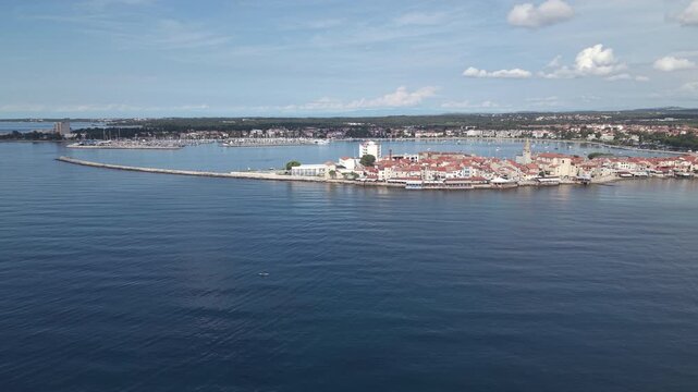 Aerial panorama of Umag old town peninsula breakwater and bay in Istria Croatia
