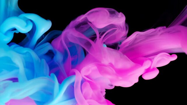 Cyan and magenta fluid plumes billow and intertwine across a black background, forming soft curling ribbons and layered translucent shapes as colors meet near center