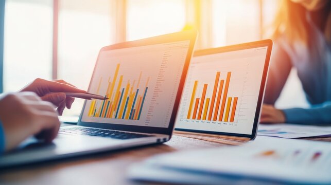 Stormy Light Near the Trend and Growth Indicators: Consultant Reviewing Laptop Graphs During Client Briefing Cha &acirc;&euro;&ldquo; Skyline Study 4