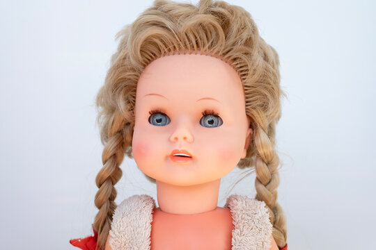 Vintage plastic doll, dress, retro toy, folk craft aesthetic, nostalgic childhood still life memories, celluloid doll face evoking nostalgia, antique collectible representing history and craftsmanship