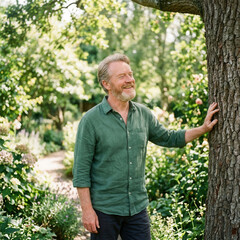 Fototapeta premium Mature Man Enjoying Tranquil Garden Serenity Outdoor Portrait