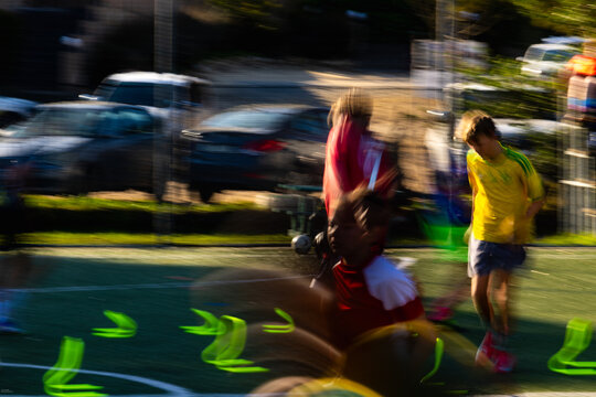 blur of color and motion, soccer game at sunset