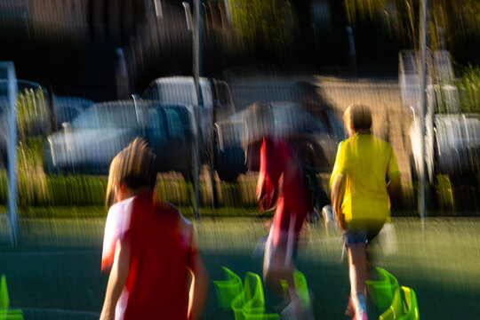blur of color and motion, soccer game at sunset