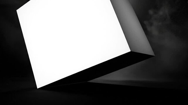 Abstract grayscale animation of a luminous white cube rotating with fog in a dark mysterious atmosphere