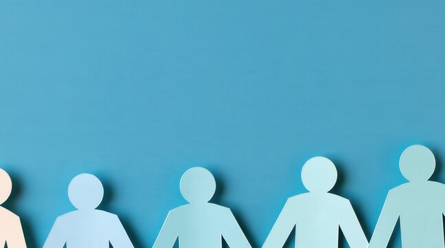 row of paper people holding hands on blue background