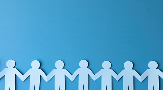 Paper people holding hands in row on blue background with copy space