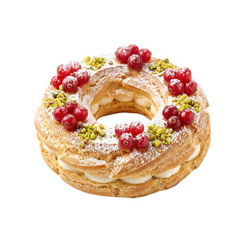 Gourmet Paris-Brest French pastry ring filled with cream and topped with fresh red currants, crushed pistachios, and a dusting of powdered sugar on white background