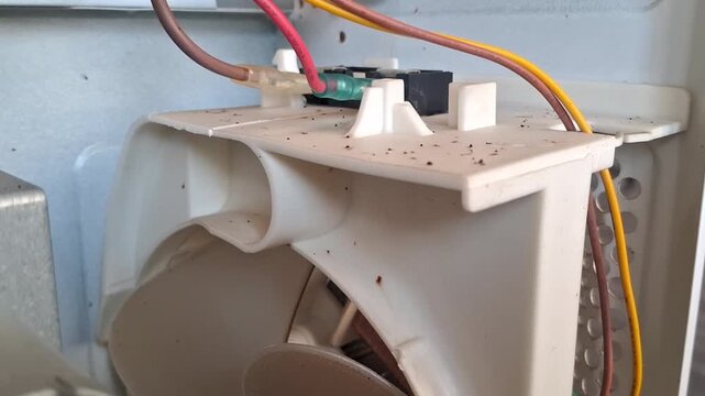 Internal cooling fan motion inside microwave appliance repair