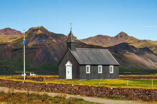 B&uacute;&eth;akirkja or Black church of Budir, old wooden church, with white door, windows and gate and was established in 1703. B&uacute;&eth;ir, Sn&aelig;fellsnes Peninsula. One of the most photographed churches in Iceland.