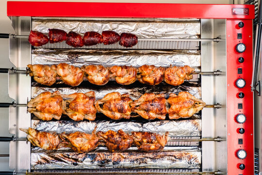 Takeout grilled chickens in oven rack