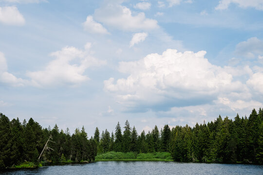 Spring sky over a mountain lake