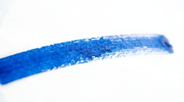 Blue paint stroke with textured edges on white background