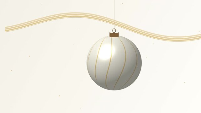 Pearl ornament and flowing gold ribbons on a cream background