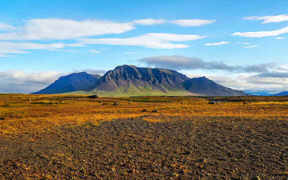 H&iacute;tardalur or H&iacute;tar&aacute; river valley, blue sky. In the center is visible Fagraskogarfjall (644 m) mountain, to the right visible Grettisbaeli (382m) and on the left Trollakirkja (862 m) mountain. Iceland