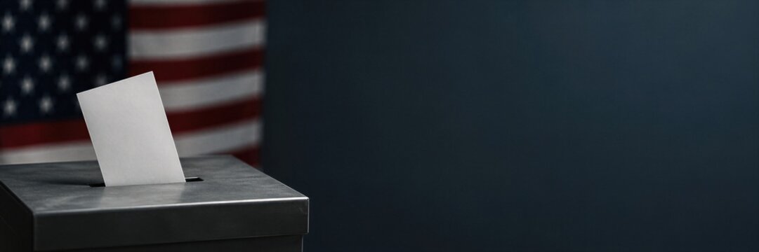 Ballot paper enters a voting box during a United States election. An American flag frames the scene. Democracy and civic participation concept for election Banner with copy space