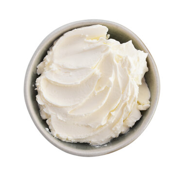 Cream cheese in a bowl isolated on a white