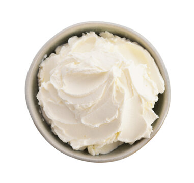 Cream cheese in a bowl isolated on a white