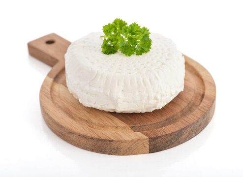 Bryndza cheese on a wooden cutting board