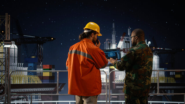 Military man and offshore rig worker monitor operations with AI anomaly detection during an oil-crisis conflict involving maritime war and an army soldier.
