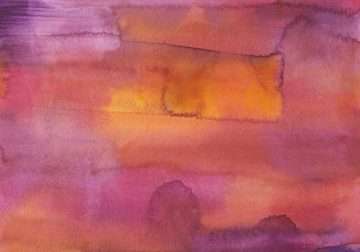 Colorful watercolor background with warm stains on paper and artistic flair