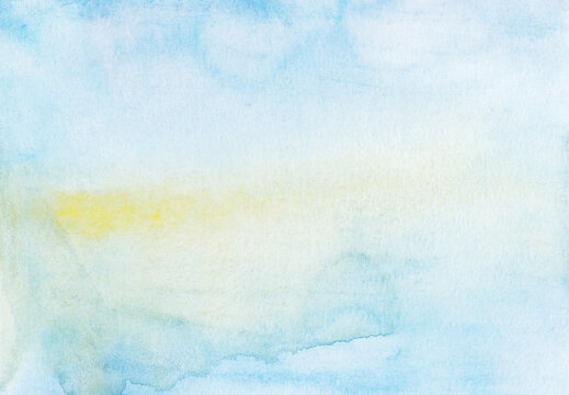 Hand painted watercolor background with light blue and yellow colors and subtle stains on paper