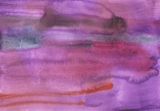 Hand painted watercolor background with stains on paper in shades of purple and blue