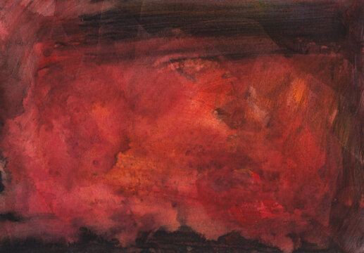 Watercolor background with stains on paper showing layers of red and orange tones