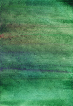 Watercolor background featuring hand painted stains on paper in green hues