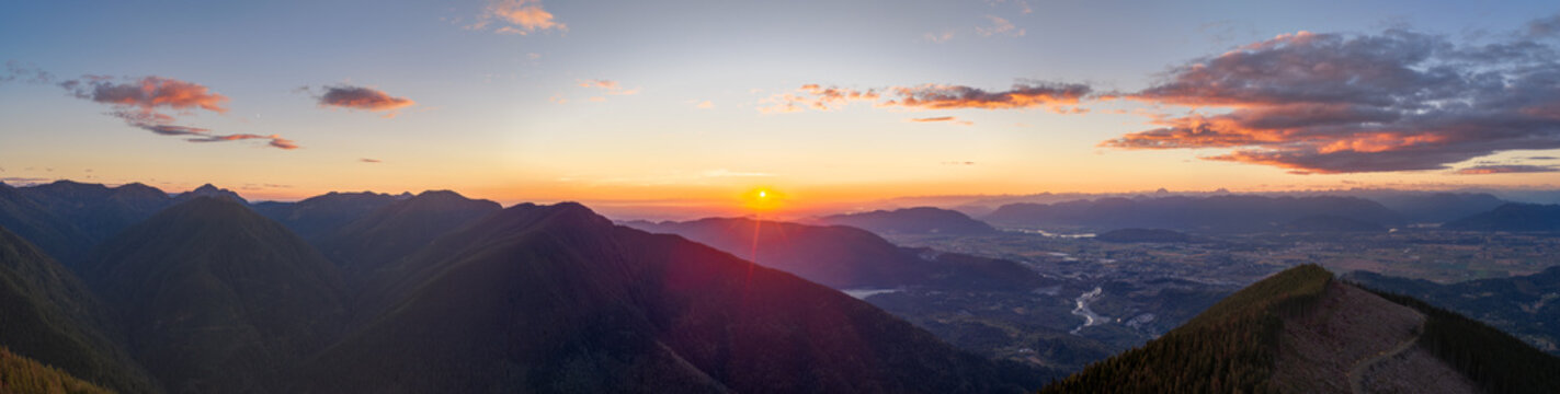 Sunset Over Mountain Ridge and Valley Panorama With Rivers Near Chilliwack, BC, Canada