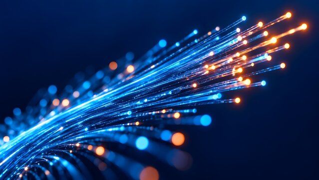Macro view of glowing blue and orange fiber optic cables transmitting digital light signals representing high speed internet and telecommunication networks