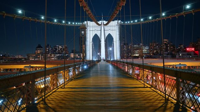 Standing on the empty wooden pedestrian walkway of the Brooklyn Bridge. Night scenery of New York City, USA in the backdrop.