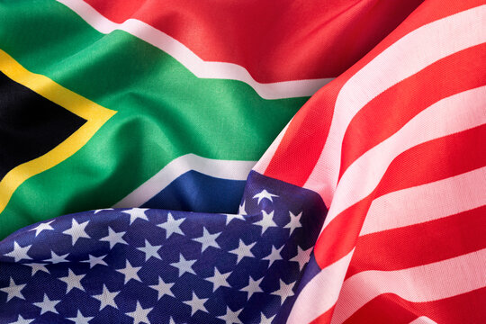 Flags of the United States and South Africa. Concept of international relations.
