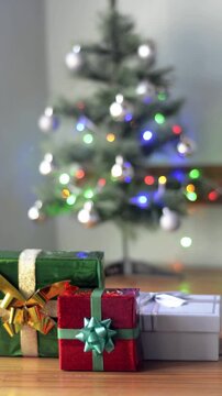Twinkling Christmas tree lights in a static holiday loop with wrapped gifts